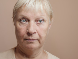 Close-up portrait of surprised middle aged woman.