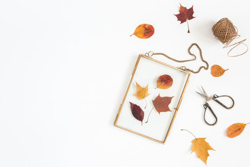 Autumn composition. Workspace with frame, autumn leaves. Flat lay, top view, copy space