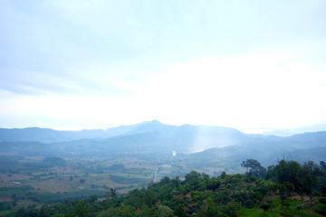 Obraz premium Beautiful landscape natural light in the morning fog and blue sky on the mountain and the sunrise shining to the mist in forest northern of Thailand.