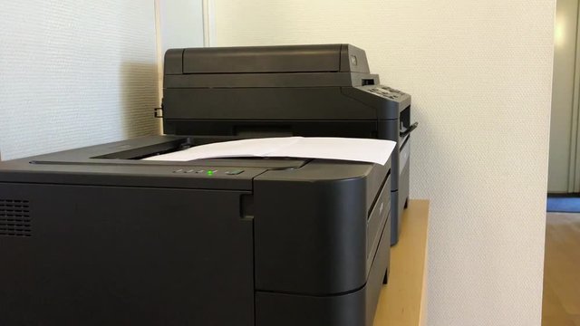 A printer printing out paper
