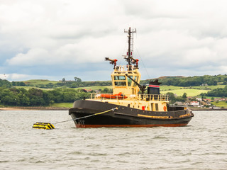 Tug boat in the Firth of Forth. Scotland, UK