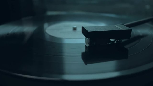 Old vintage playing a track with vinyl moves back and forth. 4k Uhd. Close-up. Cinematic footage. Timelapse.