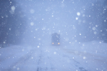 snow and fog on the winter road landscape / view of the seasonal weather a dangerous road, a winter lonely landscape