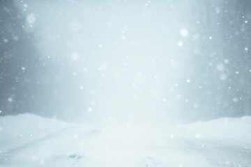 snow and fog on the winter road landscape / view of the seasonal weather a dangerous road, a winter lonely landscape