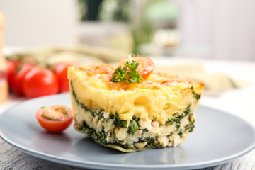 Lasagna with spinach on plate, close up