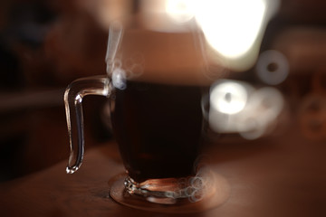 beer mug on a blurred background / beer restaurant beautiful dark beer in a mug in the interior of a pub
