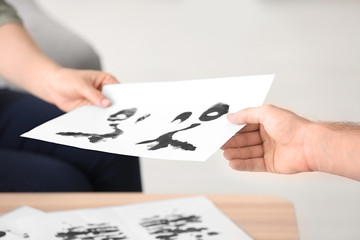 Patient passing test at reception of family psychologist, closeup