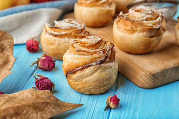 Rose shaped pastry with apple filling on table