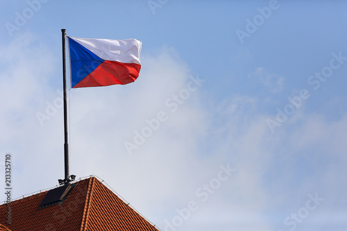 flag of the czech republic on the red roof
