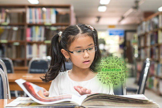 Innovative stem education and tree of knowledge concept with kid reading book in library