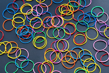 Diversity concept. mix colorful rubber band on black background