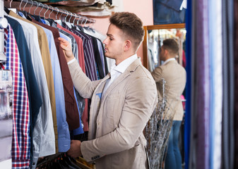 Fototapeta premium Man choosing new shirt