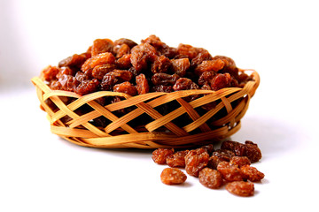 small basket of dried grape brown raisins
