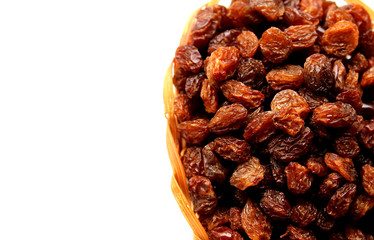 small basket of dried grape brown raisins