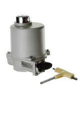 Small electric drive (actuator) gray colour for valves.  . Еxplosion-proof. Wooden and fabric background.. Wooden and fabric background.. Caption: open, closed.