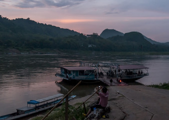 Impressive sunset on the banks of the Mekong River, Luang Prabang, Laos