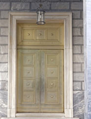 bronze metal elegant door of a banking institution