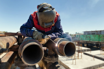 Welding works at installation of new pipeline