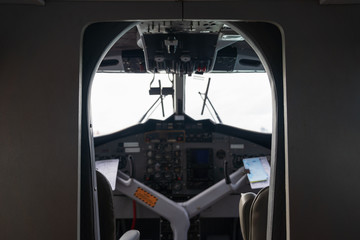 Interior details of airplane cockpit board control background.
