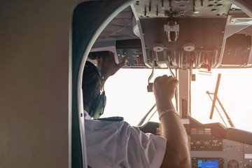 Airplane with pilot on board while flying.