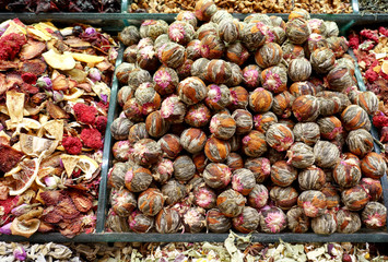 Background of different types of tea in trays close-up.