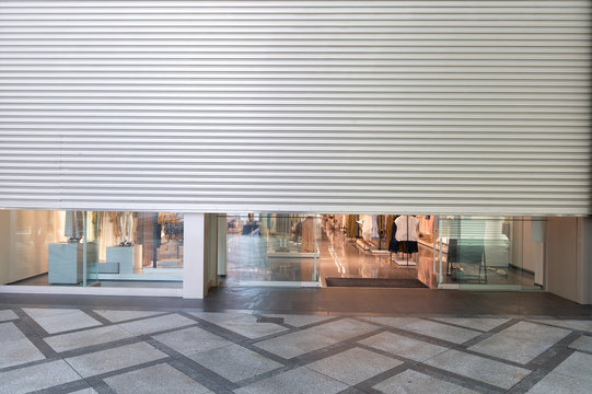 A closeup shot of automatic metal roller door used in factory, storage, garage, and industrial warehouse. The corrugated and foldable metal sheet offer space saving and provide urban and rustic feel
