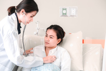 Fototapeta premium Medical at the hospital checking paperwork and patient's medical records