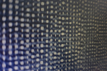 blocks of binary data. Blockchain concept. blue background with computer digital binary code bit number one and zero text. selective focus on the far end of the computer display out of focus in front.