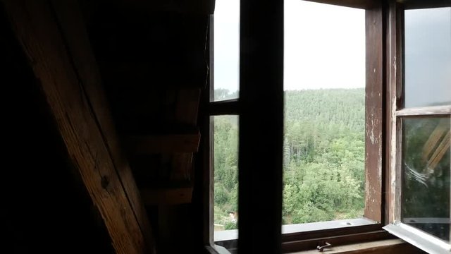 Open the window in an old wooden house.