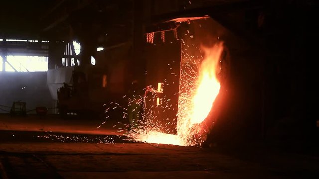 Steel Plant Employee uses oxygen lance to Blast Furance