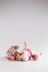 Garlic Cloves and Bulbs over white background © weyo