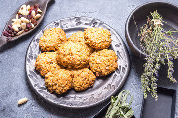 Vegan oat cookies in black ceramic plate
