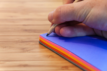 Writing in a sketchbook