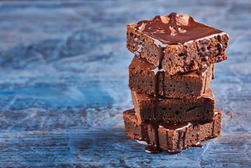 homemade chocolate brownies on dark blue background