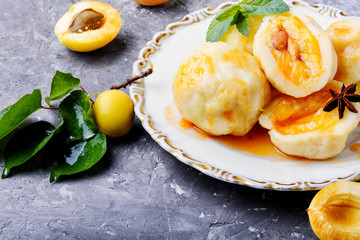 Dumplings with apricot and spicy syrup