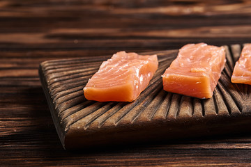 Salted salmon on the wood background