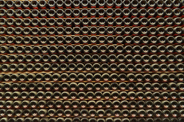 Stack of wine bottles in winery