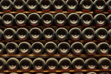 Stack of wine bottles in winery