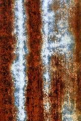 Multicolored background: rusty metal surface with silver paint