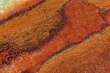 Multicolored background: rusty metal surface with silver paint