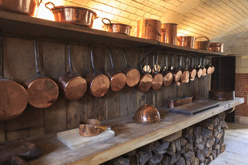 Old kitchen with copper pans in Normandy France