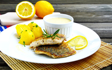 Grilled Fish with Lemon Butter Sauce and potatoes.