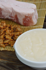 Lard bacon and crackling on wooden background and bamboo background.