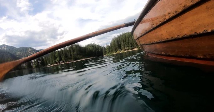 Tipi di file: Tutto (511) Vai a pagina |Prec123456Avanti Underwater shot of a wooden rowing boat traveling in the middle of the lake; in the background a beautiful landscape
