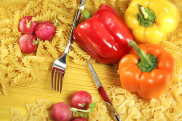 Colorful pasta and vegetables background