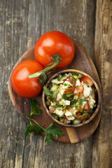 Obraz na płótnie Canvas Fresh tomato and cucumber salad
