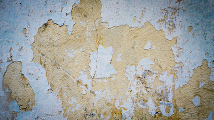 old plastered wall with spots from water