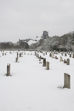 Corfe Castle Graveyard In The Snow.