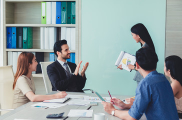 woman of business discussing ducuments and ideas at meeting.