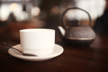 English tea in a cafe / cup and kettle with five o'clock tea